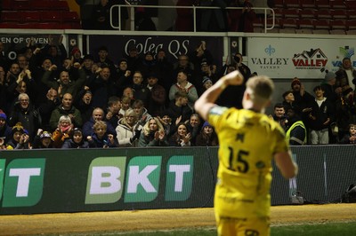 010126 - Dragons RFC v Scarlets - United Rugby Championship - Angus O'Brien of Dragons celebrates with fans at full time