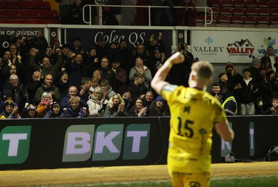 010126 - Dragons RFC v Scarlets - United Rugby Championship - Angus O'Brien of Dragons celebrates with fans at full time