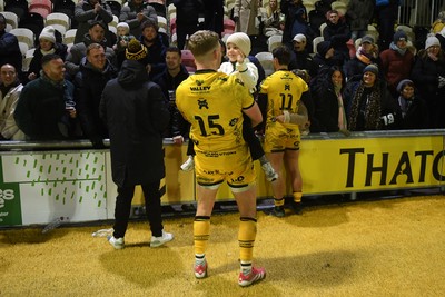 010126 - Dragons RFC v Scarlets - United Rugby Championship - Angus O'Brien of Dragons with family at full time