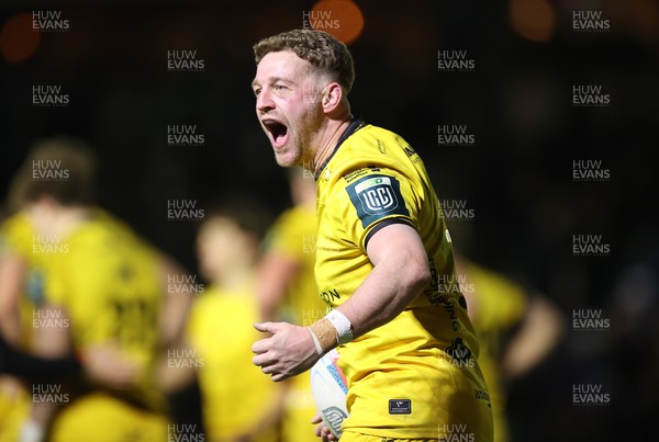 010126 - Dragons RFC v Scarlets - United Rugby Championship - Angus O'Brien of Dragons celebrates with fans