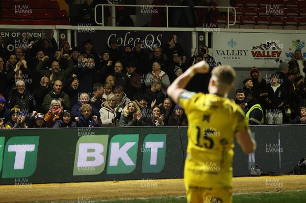 010126 - Dragons RFC v Scarlets - United Rugby Championship - Angus O'Brien of Dragons celebrates with fans at full time