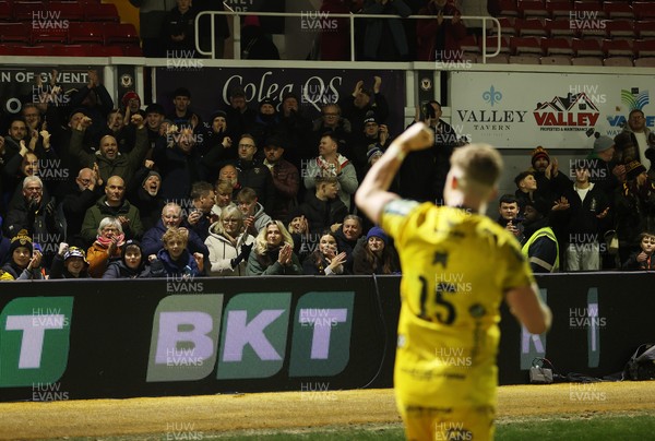 010126 - Dragons RFC v Scarlets - United Rugby Championship - Angus O'Brien of Dragons celebrates with fans at full time