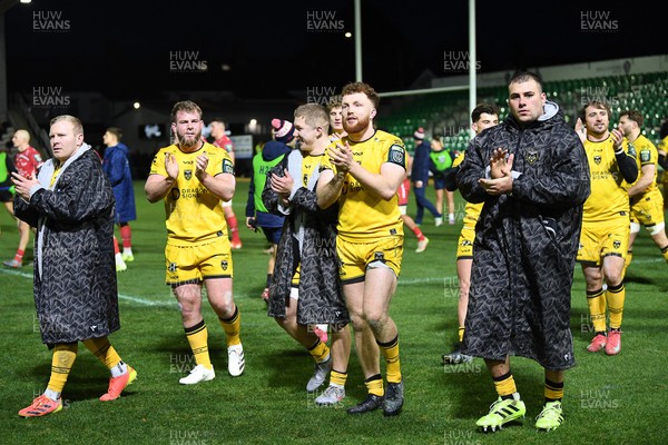010126 - Dragons RFC v Scarlets - United Rugby Championship - Dragons celebrate with fans at full time