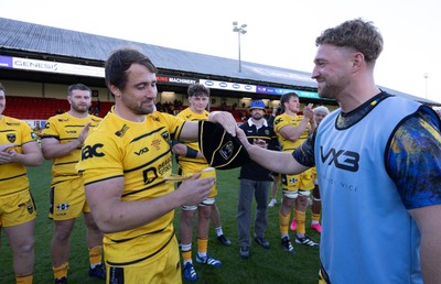 031026 Dragons RFC v Scarlets, BKT United Rugby Championship - Rhodri Williams of Dragons RFC is presented with his 150th Cap at the end of the match by Angus O’Brien