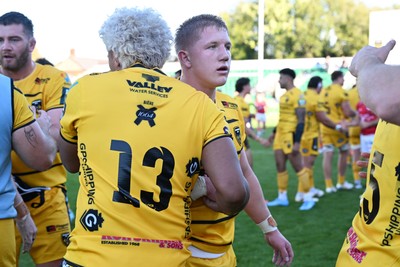 031026 - Dragons RFC v Scarlets - United Rugby Championship - Harry Beddall of Dragons and Fine Inisi of Dragons at full time