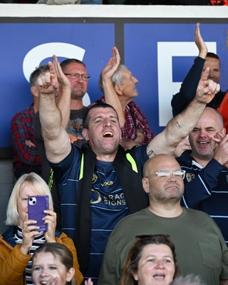 031026 - Dragons RFC v Scarlets - United Rugby Championship - Dragons fans celebrate the win at full time