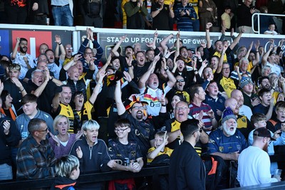 031026 - Dragons RFC v Scarlets - United Rugby Championship - Dragons fans celebrate the win at full time