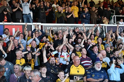 031026 - Dragons RFC v Scarlets - United Rugby Championship - Dragons fans celebrate the win at full time