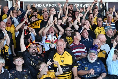 031026 - Dragons RFC v Scarlets - United Rugby Championship - Dragons fans celebrate the win at full time