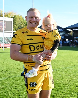 031026 - Dragons RFC v Scarlets - United Rugby Championship - Tinus De Beer of Dragons with family at full time