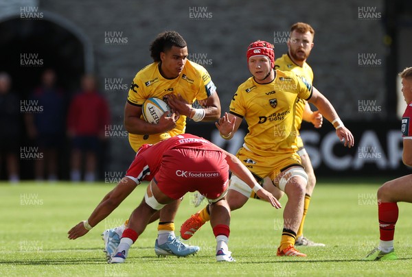 130925 - Dragons RFC v Scarlets - Pre Season Friendly - Mackenzie Martin of Dragons is tackled by Josh Macleod of Scarlets 