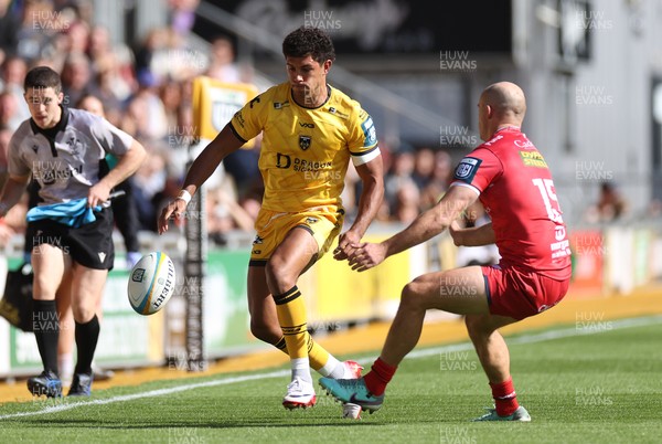130925 - Dragons RFC v Scarlets - Pre Season Friendly - Rio Dyer of Dragons is challenged by Ioan Nicholas of Scarlets 