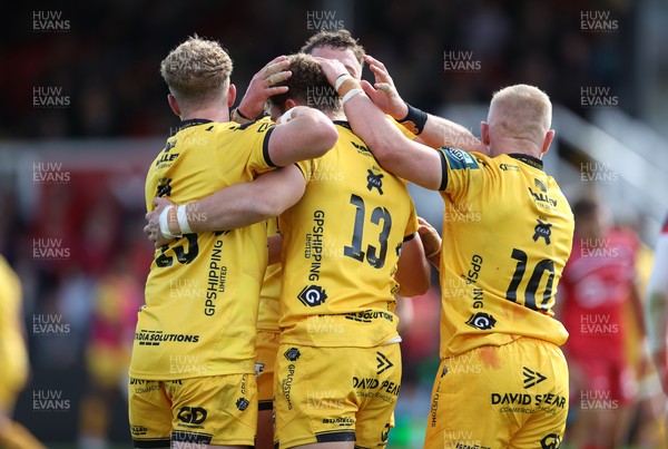 130925 - Dragons RFC v Scarlets - Pre Season Friendly - Joe Westwood of Dragons celebrates scoring a try with team mates