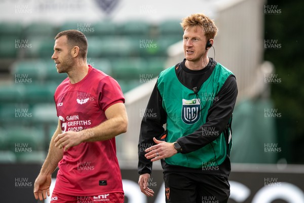 130925 - Dragons RFC v Scarlets - Preseason Friendly - Dragons Coach Rhys Patchell greets Gareth Davies of Scarlets before kick off