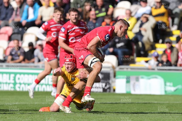 130925 - Dragons RFC v Scarlets - Preseason Friendly - Jarrod Taylor of Scarlets is tackled by Harry Beddall of Dragons 
