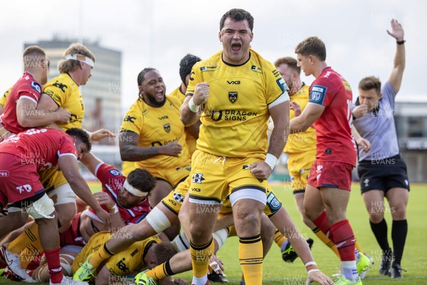 130925 - Dragons RFC v Scarlets - Preseason Friendly - Chris Coleman celebrates Harry Beddall of Dragons try 