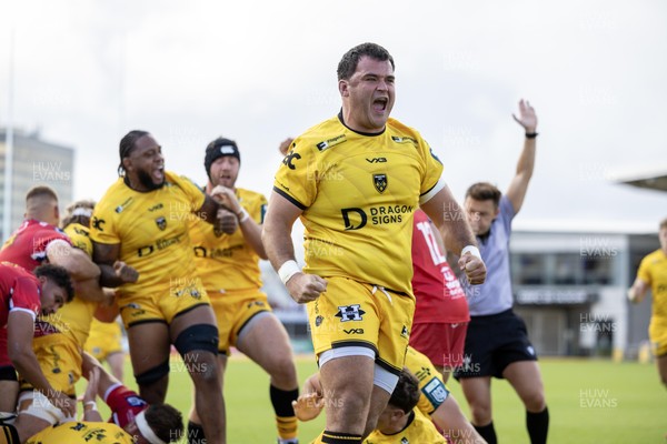 130925 - Dragons RFC v Scarlets - Preseason Friendly - Chris Coleman celebrates Harry Beddall of Dragons try 