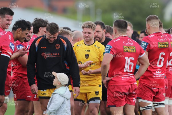 130925 - Dragons RFC v Scarlets - Preseason Friendly - Angus O’Brien of Dragons leads his team off at the final whistle 