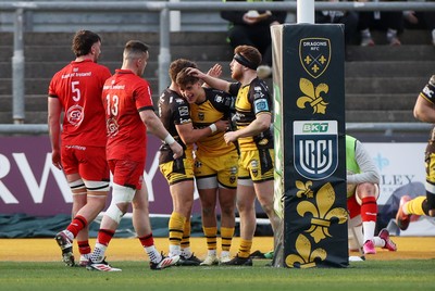 220325 - Dragons RFC v Ulster - United Rugby Championship - Huw Anderson of Dragons celebrates scoring a try with team mates