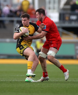 220325 - Dragons RFC v Ulster - United Rugby Championship - Dylan Kelleher-Griffiths is tackled by Matthew Dalton of Ulster 