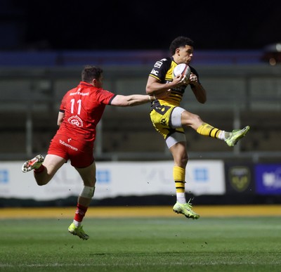 220325 - Dragons RFC v Ulster - United Rugby Championship - Rio Dyer of Dragons is challenged by Jacob Stockdale of Ulster 