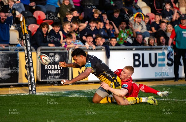 220325 - Dragons RFC v Ulster - United Rugby Championship - Nathan Dock of Ulster makes a try saving tackle on Rio Dyer of Dragons RFC