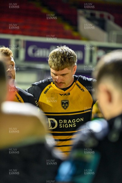 220325 - Dragons RFC v Ulster - United Rugby Championship - Aaron Wainwright of Dragons RFC in the team huddle after the match