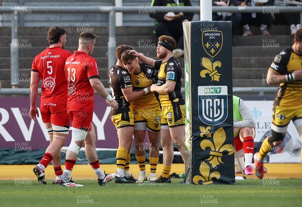 220325 - Dragons RFC v Ulster - United Rugby Championship - Huw Anderson of Dragons celebrates scoring a try with team mates