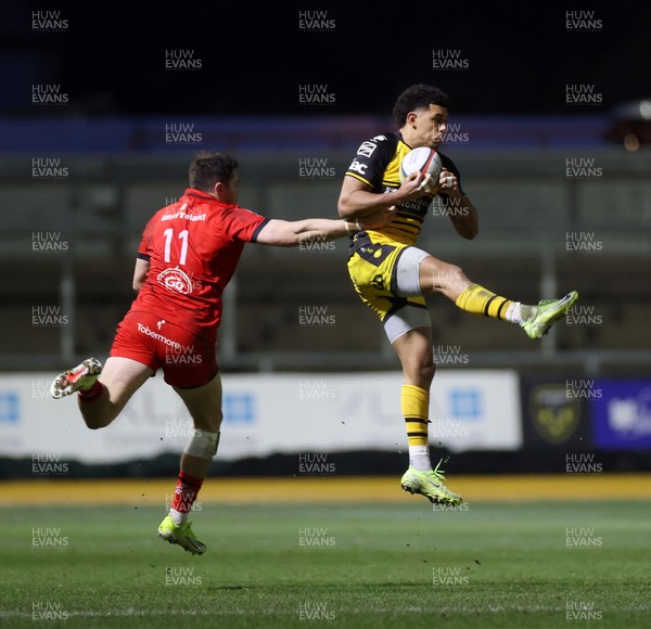 220325 - Dragons RFC v Ulster - United Rugby Championship - Rio Dyer of Dragons is challenged by Jacob Stockdale of Ulster 