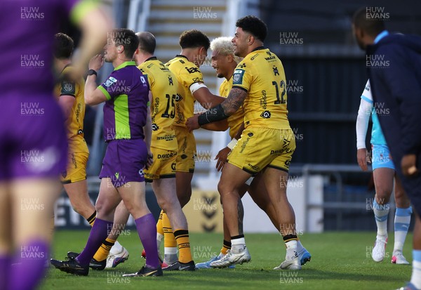 170426 - Dragons v Vodacom Bulls - United Rugby Championship - Fine Inisi of Dragons celebrates scoring a try with team mates
