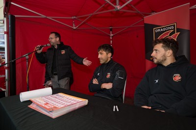 200218 - Dragons players Gavin Henson and Dorian Jones sign items and pose for photographs for fans at Festival Park, Ebbw Vale