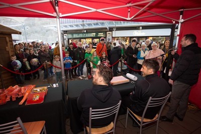 200218 - Dragons players Gavin Henson and Dorian Jones sign items and pose for photographs for fans at Festival Park, Ebbw Vale