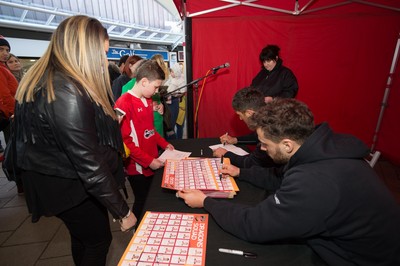 200218 - Dragons players Gavin Henson and Dorian Jones sign items and pose for photographs for fans at Festival Park, Ebbw Vale