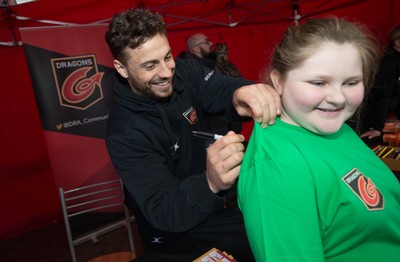200218 - Dragons players Gavin Henson and Dorian Jones sign items and pose for photographs for fans at Festival Park, Ebbw Vale