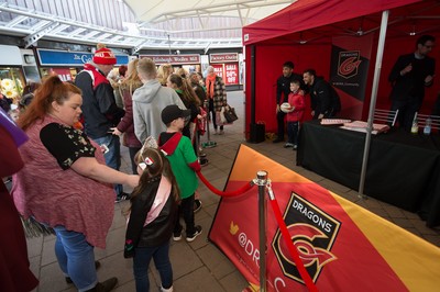 200218 - Dragons players Gavin Henson and Dorian Jones sign items and pose for photographs for fans at Festival Park, Ebbw Vale