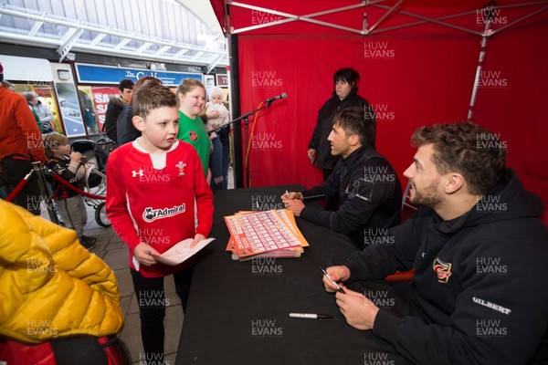 200218 - Dragons players Gavin Henson and Dorian Jones sign items and pose for photographs for fans at Festival Park, Ebbw Vale