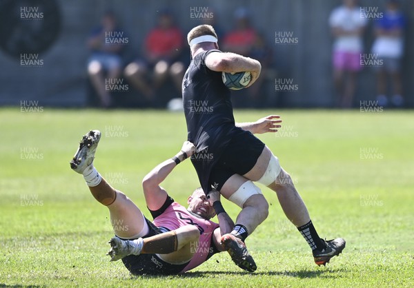 290322 - Dragons Training at Westville Boys' High School in Durban - Aaron Wainwright is tackled during training