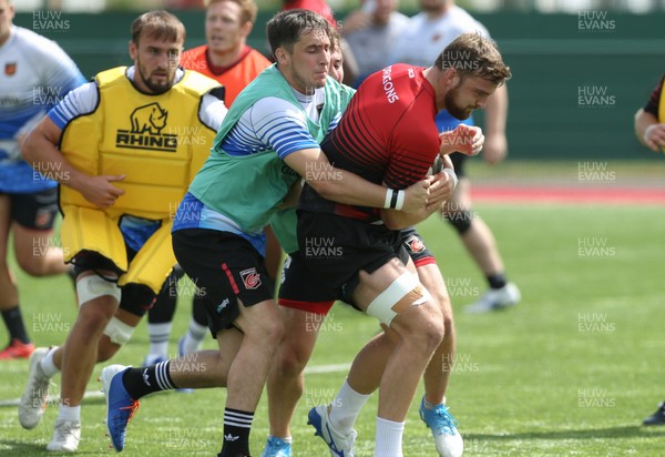 070819 - Dragons Training Session - Ben Roach is held by Sam Davies during Dragons training session