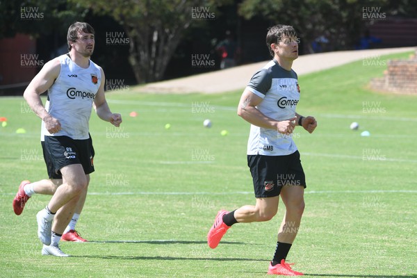 240322 - Dragons Rugby Training at Pretoria Boys High School - Gonzalo Bertranou , right, and Rhodri Williams during a Dragons training session in South Africa