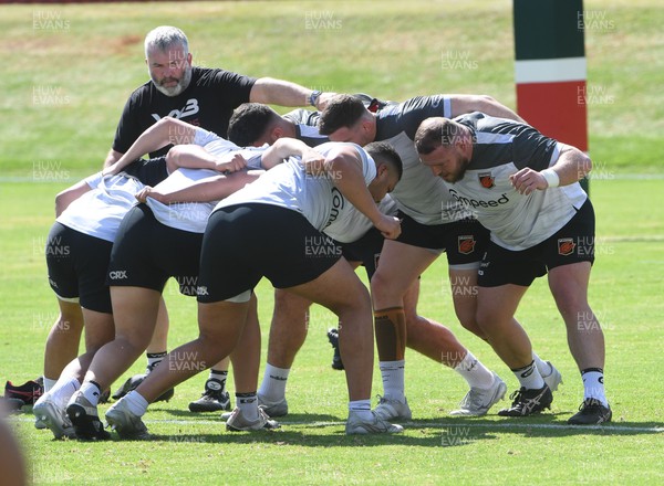 240322 - Dragons Rugby Training at Pretoria Boys High School - Dragons forwards coach Mefin Davies oversees scrummaging during training session in South Africa