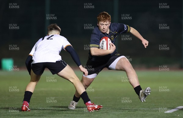 141222 - Dragons Under 18s v Ospreys Under 18s, WRU Regional Age Grade Championship - Morgan Williams of Dragons takes on Luke Davies of Ospreys