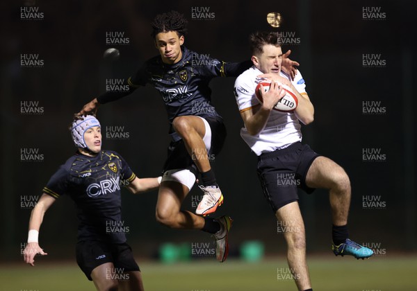 141222 - Dragons Under 18s v Ospreys Under 18s, WRU Regional Age Grade Championship - Dray Jack-Griffin of Dragons challenges Llewelyn Hawkes of Ospreys