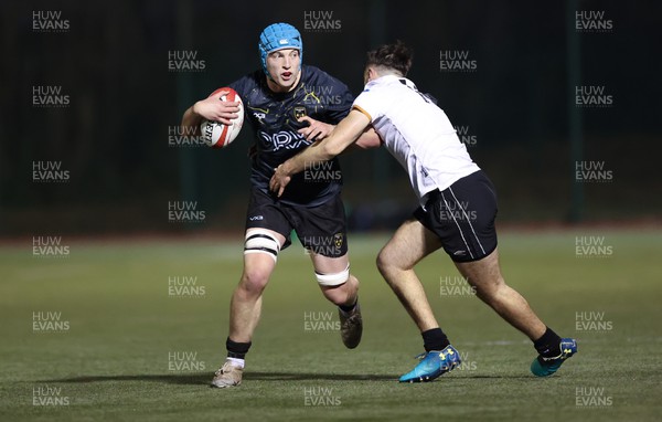 141222 - Dragons Under 18s v Ospreys Under 18s, WRU Regional Age Grade Championship - Guy Thomas of Dragons looks for support as he is tackled