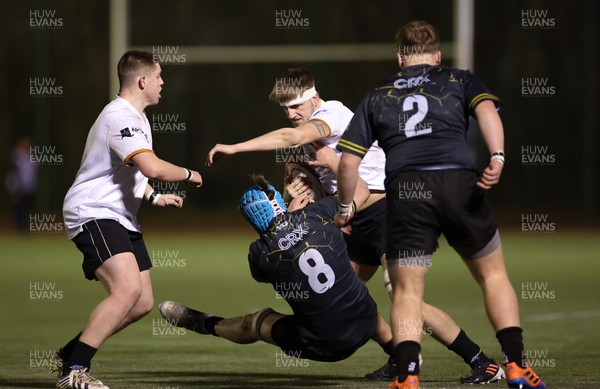 141222 - Dragons Under 18s v Ospreys Under 18s, WRU Regional Age Grade Championship - Kyle Harris of Ospreys drives through the challenge from Guy Thomas of Dragons