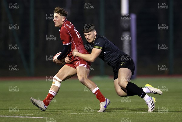080223 - Dragons U18s v Scarlets U18s - Regional Age Grade Rugby - Fraser Jones of Scarlets is tackled by Harry Rees-Weldon of Dragons 