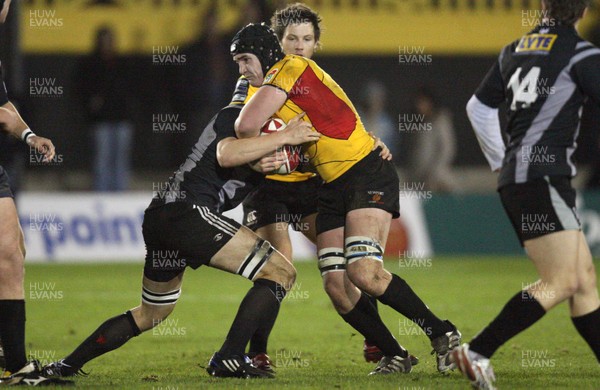 19.11.08 ... Gwent Dragons U20 v Ospreys U20, WRU Regional Championship. -  Dragons James Thomas drives into James King 