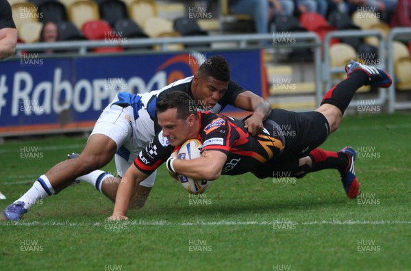 230813 - Newport Gwent Dragons v Bath, Pre-season Friendly - Dragons' Dan Evans dives in to score try