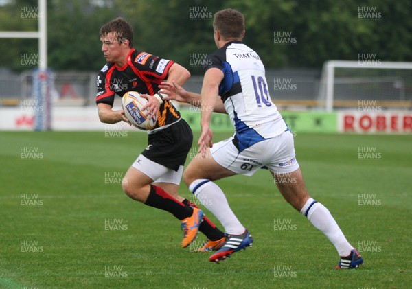 230813 - Newport Gwent Dragons v Bath, Pre-season Friendly - Dragons' Jonathan Evans takes on Bath's George Ford