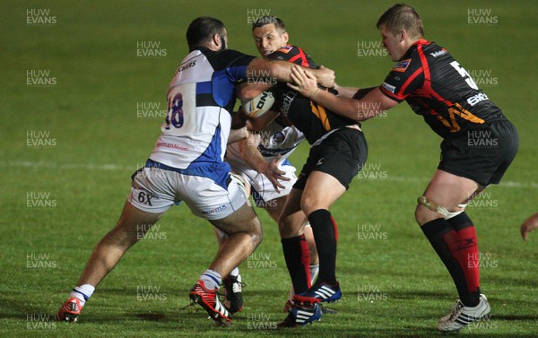 230813 - Newport Gwent Dragons v Bath, Pre-season Friendly - Dragons' Jason Tovey is tackled by Bath's Kane Palma-Newport and Bath's Mat Gilbert