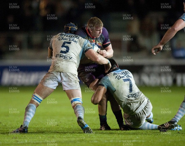 201012 - Newport Gwent Dragons v  Aviron Bayonnais - Amlin Challenge Cup   Dragon's Liam Davies is tackled by  Mark Chisholm and  Dwayne Haare of Bayonne 